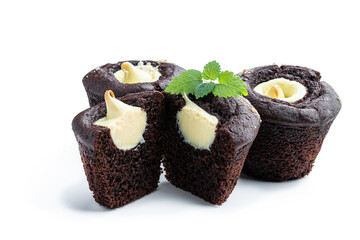 Chocolate muffins with banana cream filling isolated on white