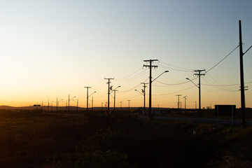 several power poles in the late afternoon