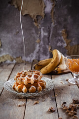 Banana honey waffles on a wooden table