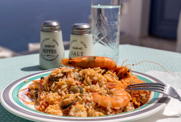 Pilaf from seafood (Greek cuisine) against the backdrop of the sea