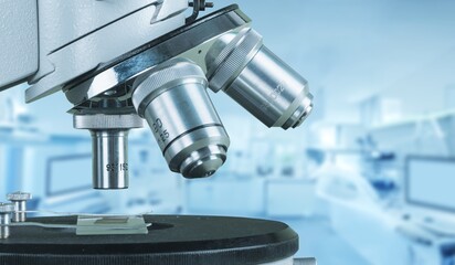 scientist prepare sample for research on microscope. Placing blood sample on microscope slide. Science and medicine concept.