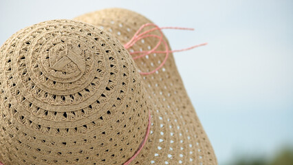 women's straw hat against the sky, close-up