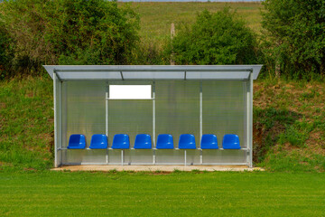 a bench on the green field, football stadium bench for team, Reserve and staff coach bench in sport...