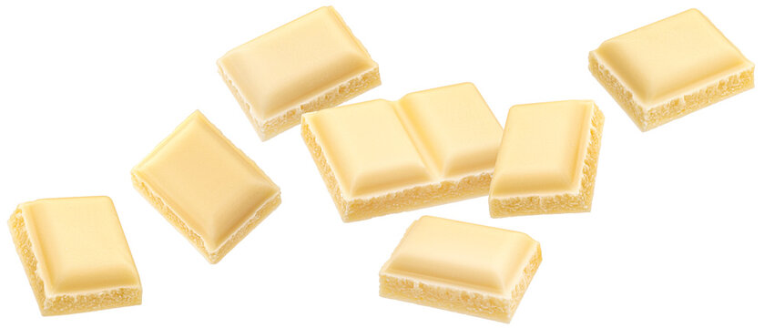 White milk chocolate pieces isolated on white background