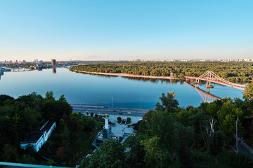 View of the Dnipro River and the Pedestrian Bridge in Kyiv, Ukraine.