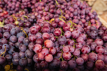 Selective focus of purple grapes group.  Purple grapes at a Farmer's Market. 