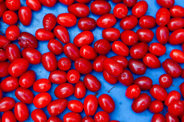 Top of view cranberries on blue background. 
