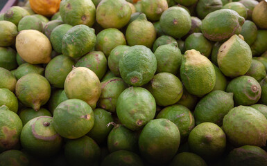 Green lemons group. Close up.