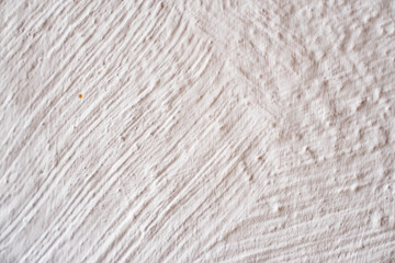 wall with white decorative plaster. background and texture of plaster.