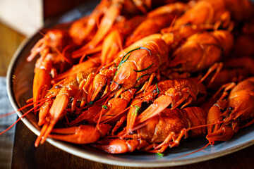 an appetizer with beer from whole boiled river crayfish.