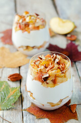 Caramelized apple pecan greek yogurt parfait in a glass