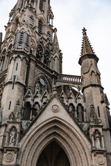 Fototapeta premium european midevil gothic church cathedral entrance and tower brick
