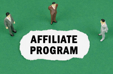 On the green surface there are figures of businessmen and there is torn paper with the inscription - AFFILIATE PROGRAM