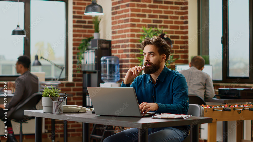 Aufkleber thoughtful businessman brainstorming ideas to create report on laptop, feeling pensive and thinking 