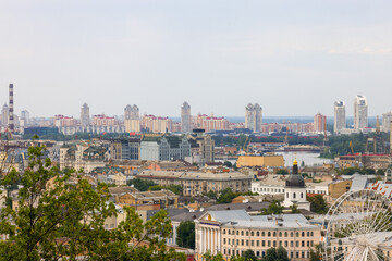 Fototapeta premium beautiful view of summer Kiev. Roofs of Podol and a view of the left bank