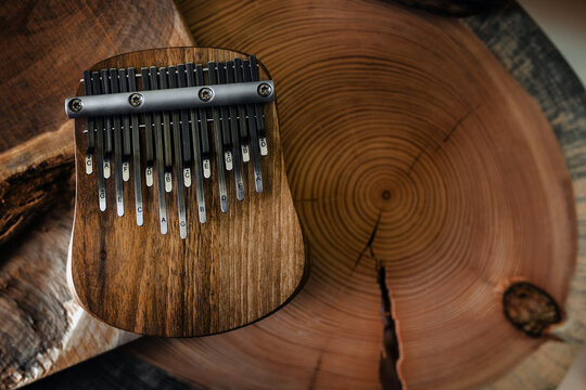 Kalimba - a musical instrument with a wooden soundboard and metal keys. In the classification of musical instruments the kalimba is in the category of lamellophones or plucked idiophones.