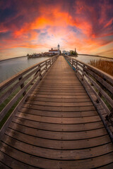 Obraz premium porto lagos church on a lake with a wodden bridge