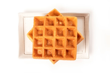 Waffles on white plate isolated on white background
