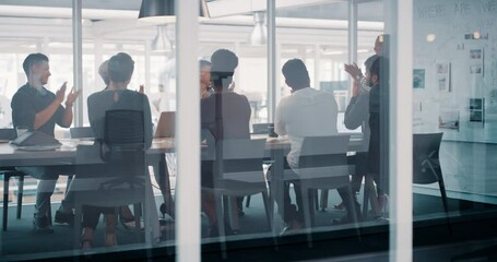 Excited corporate business team clapping, celebrating project success of presentation meeting in boardroom work office. Diverse group of colleagues sitting by table applauding leadership innovation.