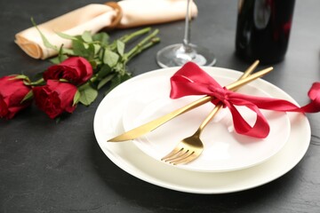 Beautiful table setting for Valentine's Day dinner on black background, closeup