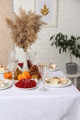 Table set with beautiful autumn decor for festive dinner