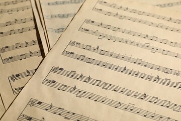 Obraz premium Many old note sheets as background, closeup