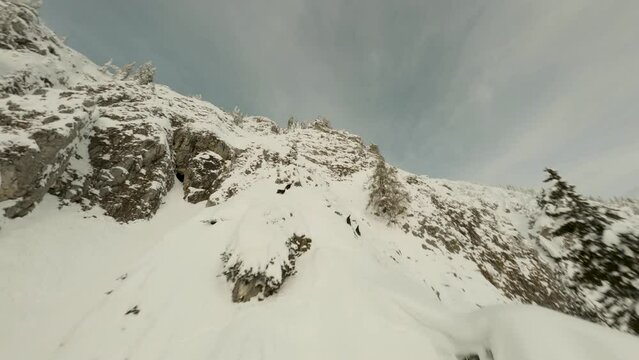 Chamois chasing in mountains, winter, rocks with snow, part2