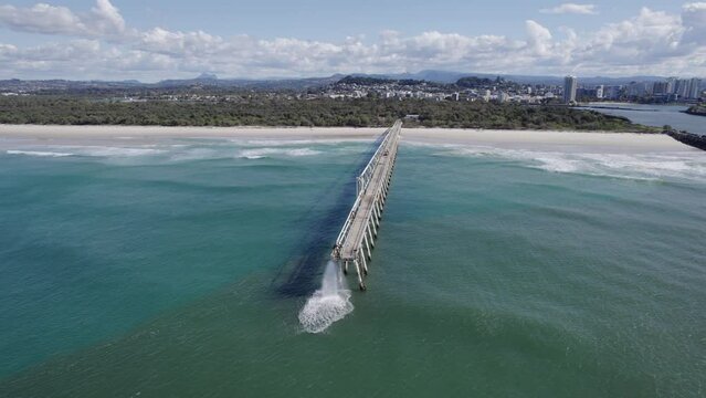 Sand-Water Mixture Discharging Through Tweed Sand Bypassing Facility On A Jetty At The Letitia Beach In Fingal Head, NSW, Australia. aerial drone