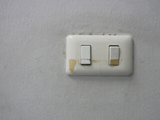 old and dirty light switch on the wall.