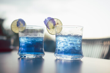 Butterfly pea flower juice with lemon slice, amazing colorful drinking