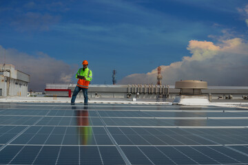 solar panel installation. Solar cells have been maintained and maintenance by a team of engineers.  two engineers checking solar cells on power plant background. 