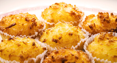 Queijadinha or queijada, sweet baked dessert from a traditional bakery and pastry shop from Brazil and Portugal, made with eggs, cheese or coconut, and lots of sugar.