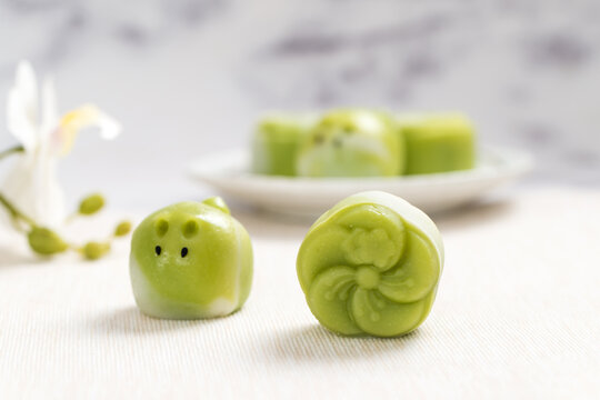 Traditional Chinese mid autumn festival dessert snowy skin rabbit shape mooncakes. The flavor is matcha green tea with pantan lotus paste