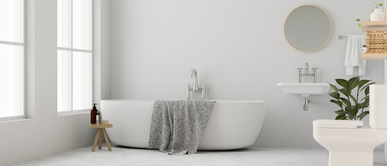 Modern elegance white bathroom interior design with bathtub, toilet, towel, washbasin and decor