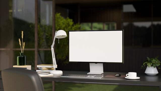Modern stylish workspace interior design with modern PC computer mockup over blurred dark background