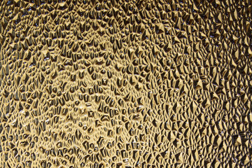 Translucent Glass Close-up Surface with Refractive Light. Uneven Bumpy Semitransparent Texture Background	