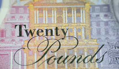A closeup of £20 Twenty pounds cash money bill Sterling polymer banknote from the bank of England...