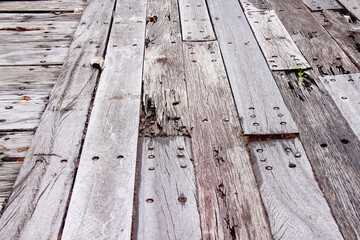 Old plank wood bridge on floor weathered background