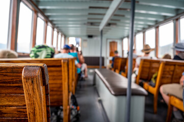 focus on wooden bench on a tour boat in Glacier National Park, Montana, USA