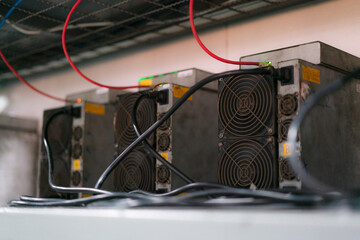 ASIC mining equipment for cryptocurrency on steel container.  Bitcoin miners in farm.
