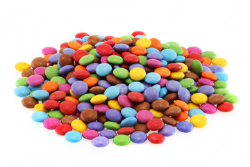 Heap of multi coloured halloween candy sweets on white