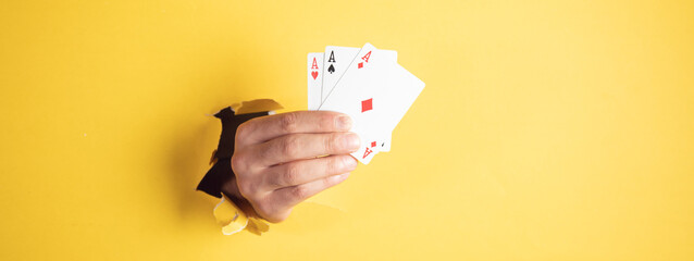 man hand playing cards - Powered by Adobe