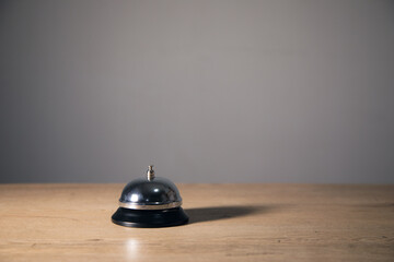 call bell on wooden table