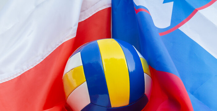Volleyball ball with flags of Poland and Slovenia, host countries of Volleyball World Championship tournament in 2022. World cup sport background.