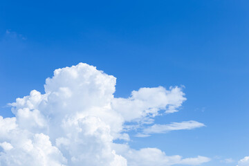 Naklejka na ściany i meble White cloud over blue sky background, nature and weather concept background