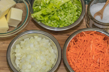 Chopped vegetables and other ingredients ready to use in recipe.