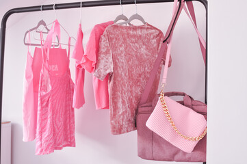 Pink woman's clothes in fitting room ,summer and spring look for girls. High quality photo