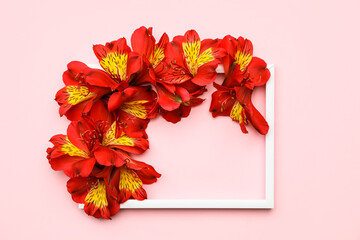 Composition with empty picture frame and alstroemeria flowers on pink background