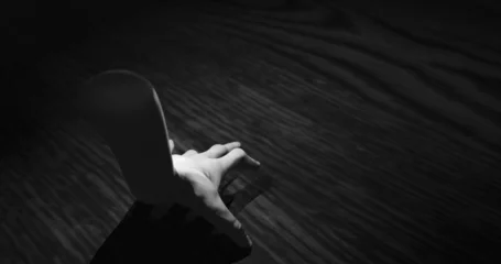 Rolgordijnen Image of hand walking in dark space © vectorfusionart