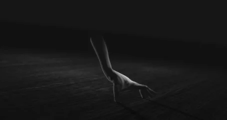 Gordijnen Image of hand walking in dark space © vectorfusionart